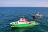 The image shows The image shows the NR Rebellion hybrid Typhoon Class CTV and OEG’s support vessel Tess on the water