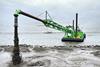 DEME dredger at work reinforcing the dyke at Marken