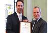 Sir Jeremy de Halpert, deputy master of Trinity House presents Chris Smith, systems engineer at Tideland Signal, with the special award.