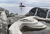 The image shows tide pools integrated into the rock breakwaters