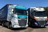 The image shows a Williams Shipping and GIF Transport truck side by side