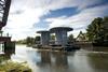 Giant steel spools are towed past the refurbished bascule bridge on the River Cart. Photo by David Murray.