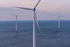 The image shows offshore wind turbines