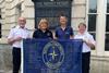 The-anniversary-flag-is-now-at-Trinity-House.-L-R-David-Crozier-NCIs-CEO-Nicola-King-NCI-Filey-Ian-Clarke-Sirius-Insight-Gillian-Woodcock-NCI-Filey.-Credit-Dav