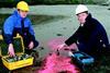 Dr Black (left) and his partner Sam Athey testing sediment movement on the River Clyde.