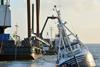 The floating crane Sanne A prepares to lift the grounded trawler. Photo: Kent Bandholm Hansen