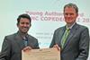 Mr. Dassanayake (left) receives the IADC Award for the Best Paper by a Young Author from IADC Secretary General René Kolman at PIANC COPEDEC.