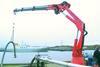 A dock terminal operator tries out the hose handling capability of the newly installed Heila marine crane at Northumberland Dock.