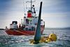 The turbine unit is semi-buoyant and can be easily towed to and from the point of operation.