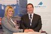 Sharon Mainprize from Mainprize Offshore and Nick Warren, managing director of Burgess Marine, sign the paperwork at Seawork 2015