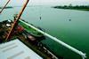 The Mirabella V mast is loaded onto a barge at VT Halmatics Portchester shipyard.