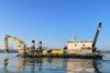 The image shows the Boskalis the backhoe dredger Manu Pekka at sea
