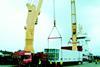 The valuable cargo is transferred from ship to road transport using a Modular Lifting Beam.