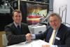 WaterMota MD Mike Beacham (right) concludes the deal with his SSL Marine counterpart, Lee Russell