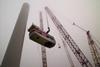 The Turbine B rotor assembly is lifted for the Beatrice Wind Farm Demonstrator Project in Scotland’s Moray Firth. The project included two 5MW turbines, the world’s largest at the time. Photo: Beatrice – Talisman Energy