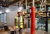 Russell Mayall, Oxford University DEng student, with the monopile test equipment in the Fast Flow Facility at HR Wallingford