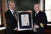 Captain Patrik Norrga°rd (left) of the P&O Ferry, 'MV Norstream' accepts his award
