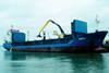 The first Sennebogen 870R material handler in a UK port is seen at work unloading scrap in Poole Harbour.