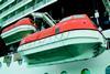 Two of the Millennium lifeboats are hoisted on their new hooks.