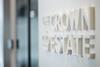 The image shows a wall emblazoned with The Crown Estate