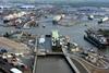 The car carrier Fidelio inaugurates the new Kaiserschleuse. Ahead are the car terminals. To the left are Lloyd Werft and Rickmers Lloyd. To the right is MWB.