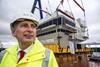 The QE Class carrier’s forward island lift was witnessed by UK Defence Secretary Philip Hammond