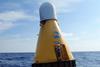 A technician prepares to conduct routine maintenance on the OceanNet buoy in the Mediterranean Sea.