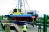 Having successfully completed trials, Dollaghan is placed on a low loader for transport to Coleraine.
