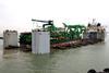 Heavy lift ship ‘Kang Sheng Kou’ prepares to download a large ‘package’ of dredging equipment.