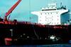 The specially adapted barge Falmouth Jubilee extracts oil slops from the tanker Tikhoretsk.