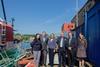 Alex Lake (CMN), Mark Williams (Falmouth Town Council), Sarah Newton (MP for Truro and Falmouth) and Paul Wickes (CMN) celebrate with Diccon Rogers and Anne van Houten (KML) the purchase of Falmouth Wharves by KML