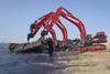 The excavators, seen working from shore, will primarily be deployed from a pontoon during the Mauretania project.