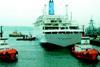 The Celebration is assisted from Falmouth following its five month refit.