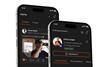 The image shows a close up of two phones displaying The Hood social platform
