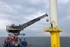 The Ampelmann A-hoist lifting cargo to an offshore wind turbine in the North Sea