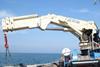 A 370t/m HS.MARINE knuckle boom crane in operation