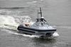 The image shows the ARCIMS unmanned surface vessel (USV) in operational mode