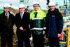 Executives from FSL and Wightlink Marine are seen with the ferry Cenred.