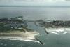 An aerial view of Hvide Sande Harbour with the current harbour design.