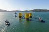 The image shows WindFloat leaving Lisnave dock after construction near Setúbal, Portugal