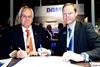 Nick Jeffrey of Solent Towage (left) and Arjen van Elk, sales manager for Damen Shipyards, sign the contract for two new tug/workboats