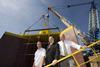 Cllr Paul Watson (centre) meets Jonathan (left) and Harry Wilson of Wear Dock and Engineering before the generator set sail.