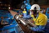 Tata worker Paul Thomson accurately positions a clamp to secure tubular sections ready for welding