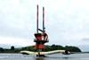 SeaGen is seen in Strangford Lough with its ‘underwater windmill’ rotors raised for maintenance. Note tidal flow past turbine tower. Photo courtesy of Marine Current Turbines.