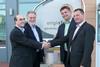 Cosalt's company secretary Neil Carrick, managing director of Cosalt's renewables business Winston Phillips and Henrik Moeller-Jensen and Lauge Fredhave, the joint owners of APRO, shake hands after the deal was signed.