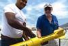 Russell Bennett (r) prepares to survey for shipwreck sites in Panama’s old harbor area with his JW Fishers Proton magnetometer