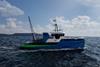 The image shows a ship model of the new research vessel at sea