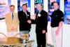 In a signing ceremony at seawork2002, Halmatics Ian Strugnell and D. Ferran and Sons Justin Ferran (left and right centre) are flanked by Tony Ward of Volvo Penta and Andrew Stammers of Jotun.