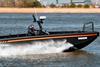 The image shows an HDPE workboat on the water