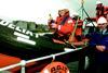 Dave Macmillan, Lesley Davidson, George Masson and George McGhie of RGIT Montrose toast the new fast rescue craft as it prepares to make its maiden voyage.